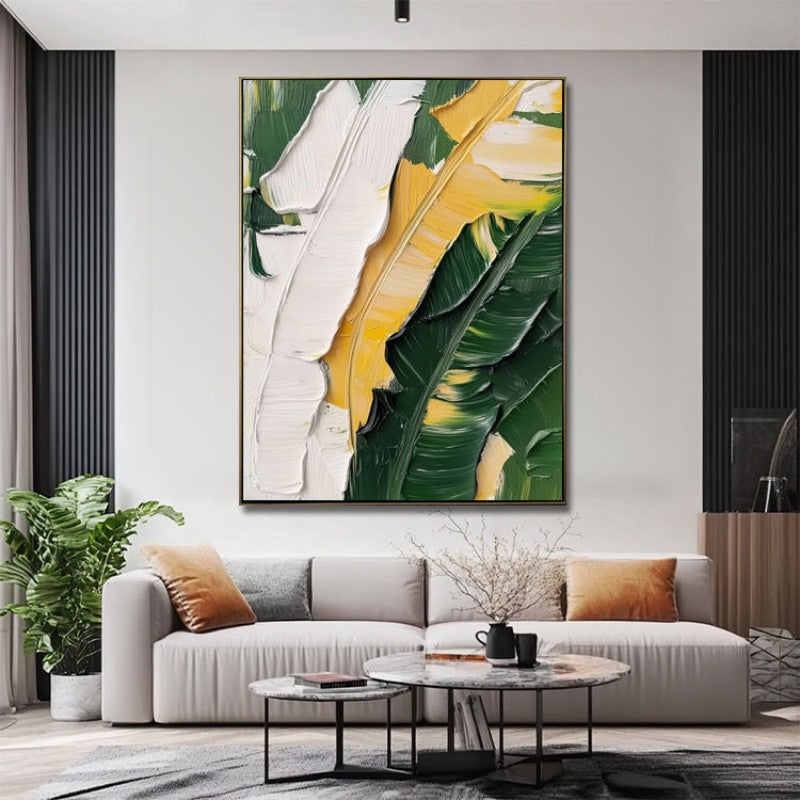 Modern living room with a large abstract painting of leaves on the wall.