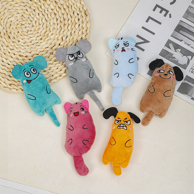 Set of colorful plush toys shaped like animals on a textured surface.