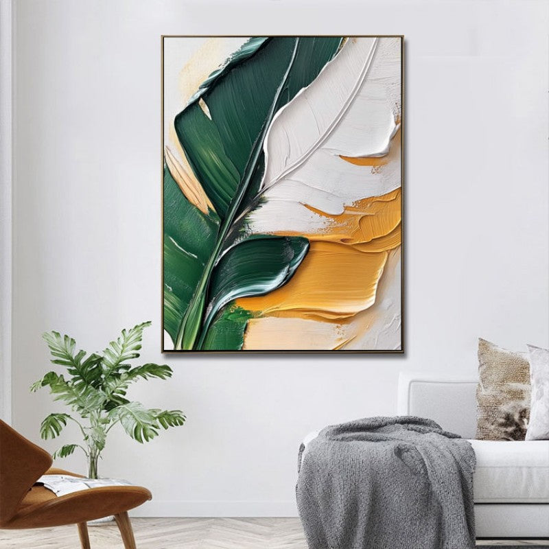 Abstract art print with green and yellow leaves in a modern living room setting.