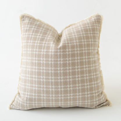 Textured pillow with a geometric pattern on a white background
